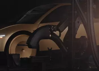 Tesla показала робота, который пылесосит и  чистит роботакси (+видео)