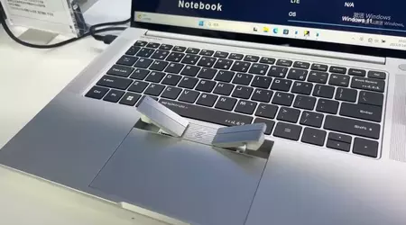 2-in-1: A Chinese company has unveiled a laptop with wireless headphones built into the touchpad