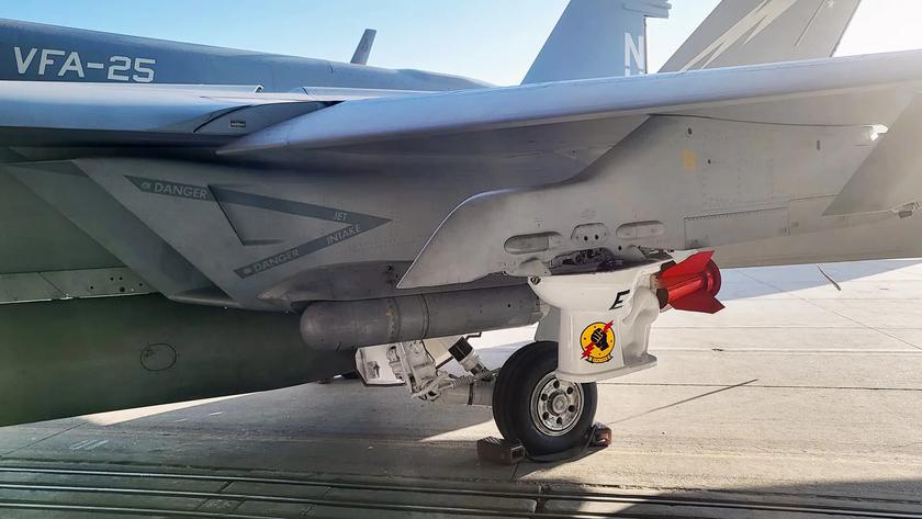 U.S. Navy showed F/A-18E Block III Super Hornet fighter with a toilet bowl as a bomb