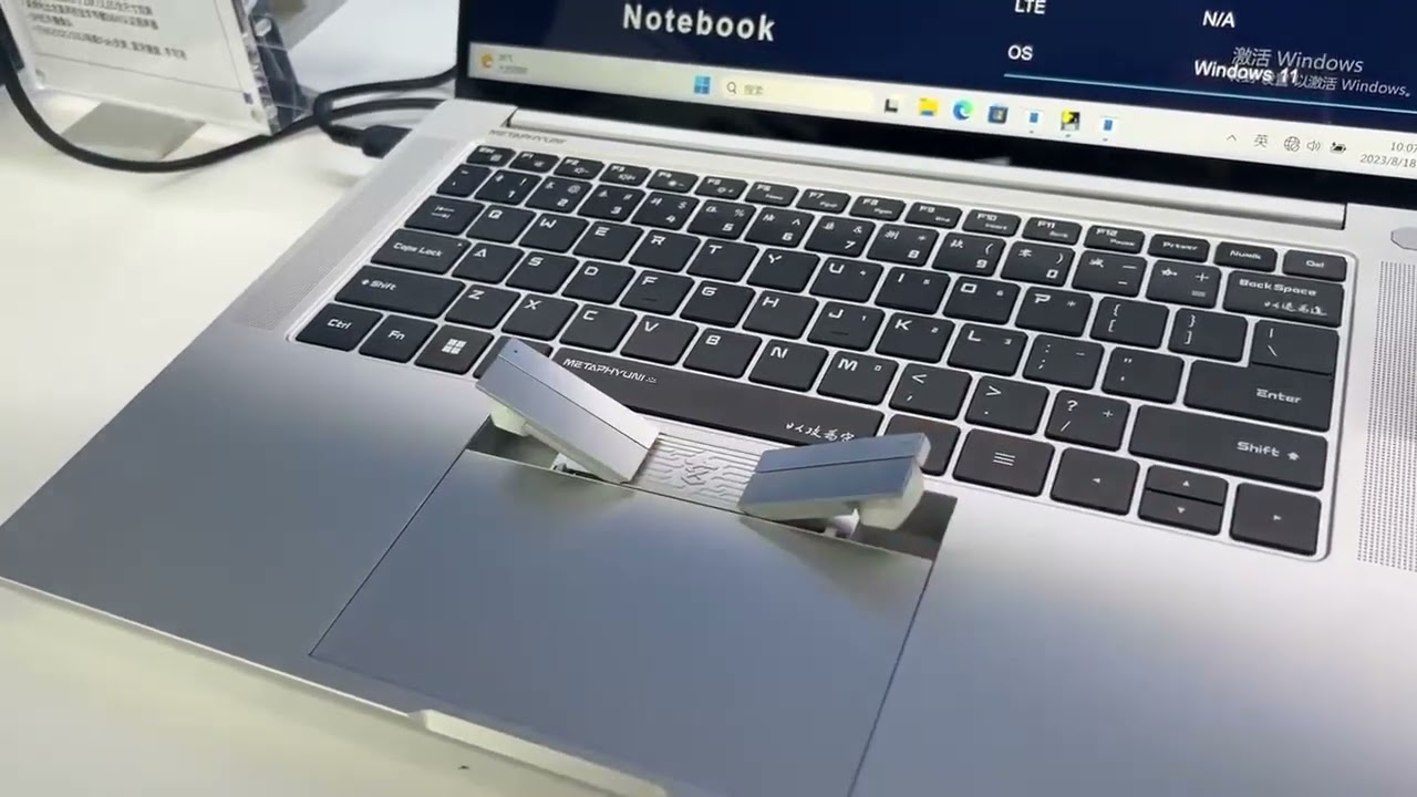 2-in-1: A Chinese company has unveiled a laptop with wireless headphones built into the touchpad