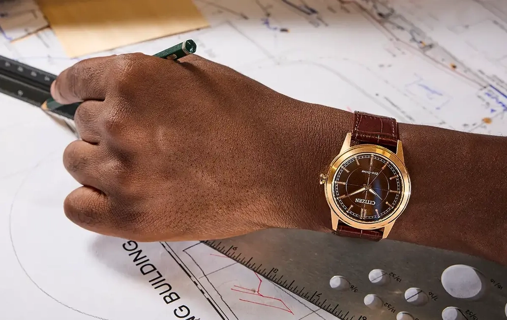 Citizen Rolan AW2113-16X in brown, with rose gold-tone case and matching leather strap.