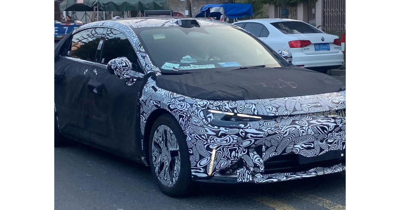 Smart sedan prototype #6 with aerodynamic lines and aggressive lighting