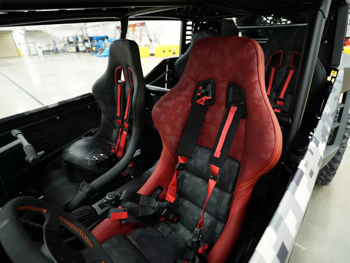 Muddy tires and FIA safety cage on Scion 01