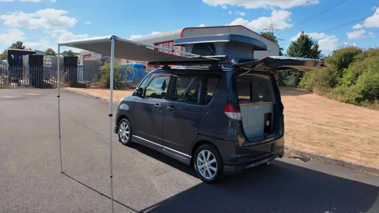 Overview of Mitsubishi Delica D:2 with awning