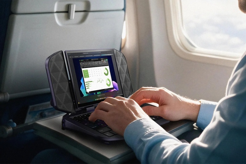 Project DualPlay Mini in laptop mode, with the backlit keyboard revealed and the display pivoted upward.